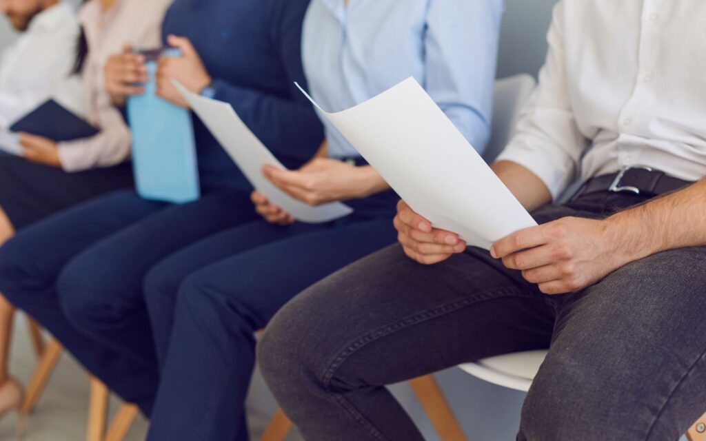 People waiting with papers